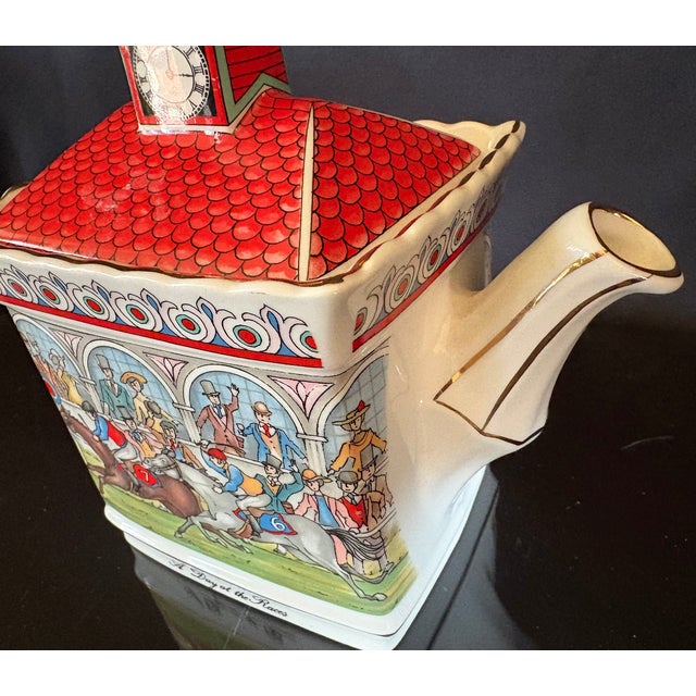 This is a beautiful piece of vintage china. It is a beautifully detailed ceramic teapot. It depicts a horse racing scene,...