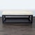 Travertine top on a metal base. Brand: Kreiss. Dimensions (in): 60W x 30D x 21H.