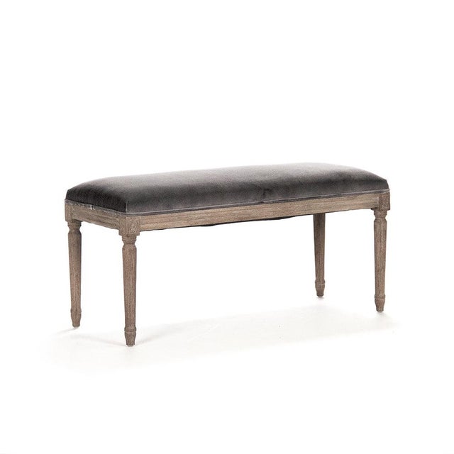 The Lille Bench from Zentique in dark charcoal velvet offers a moody, sophisticated take on the French upholstered bench....
