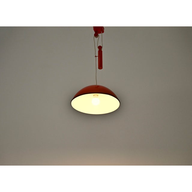 Pair of metal pendant lights designed in the 1970s by Achille Castiglioni. Model: Relemme. Maximum height with cable: 100...
