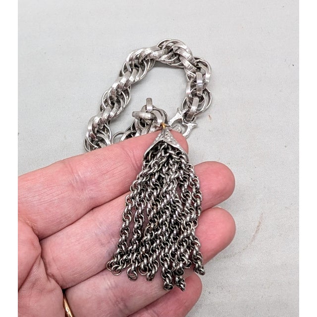 Metal Vintage 1960s Signed Monet Rhodium Plated Tassel Charm Bracelet For Sale - Image 7 of 8