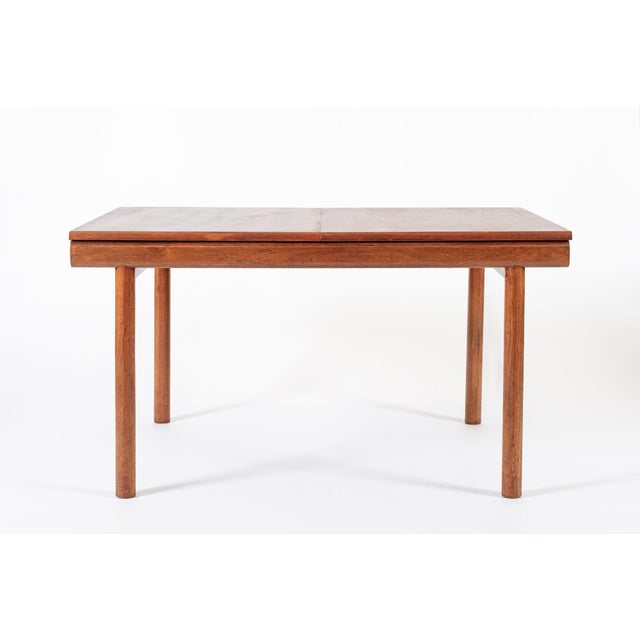 This unique vintage mid century English modern extendable teak dining table by White and Newton was made in England circa...