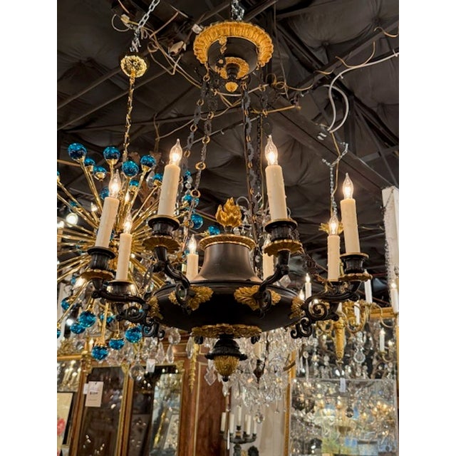 Nice quality 19th century French Empire bronze chandelier. Circa 1890. The chandelier has been professionally rewired,...