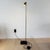CicloItalia Floor Lamp by Catellani & Smith with a natural brass structure, black base, frosted glass diffuser, and an...