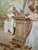 Oil on canvas depicting a social scene in a wooded garden, around a pedestal surmounted by a classical statue. Three...