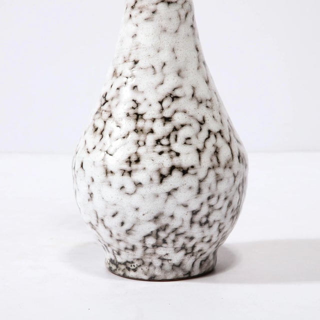 This Mid-Century Modernist Ceramic Vase is a beautiful example of Post War European Ceramics, realized in Hódmezovasarhely...