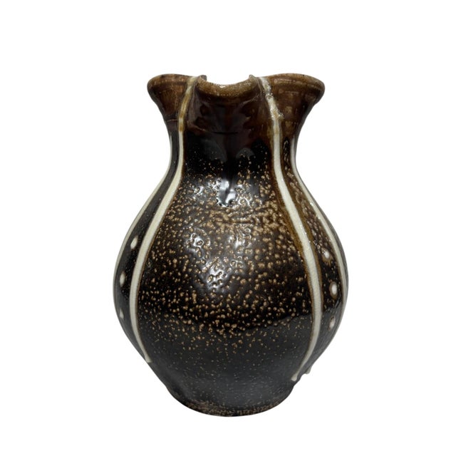 Beautiful decorative pottery pitcher inspired by the timeless designs of Daniel Johnston. Crafted in rich brown glazed...