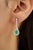 These dangle earrings feature 0.79 carats of pear-shaped emeralds set in 14K white gold. Each emerald measuring 3.8 x 5.8...