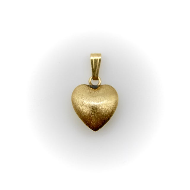This 14k gold puffy heart charm is from the 1970’s and has a Florentine finish that gives it a gorgeous matte glow. The...