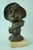 Description of the item: Delightful bronze bust depicting a young boy wearing a hat, mounted on a travertine marble base,...
