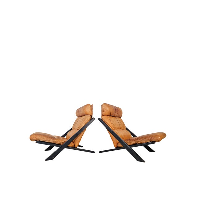 The 'DS-80' lounge chair designed by Ueli Berger for De Sede. The frame is a stark, dark grey angular structure composed...
