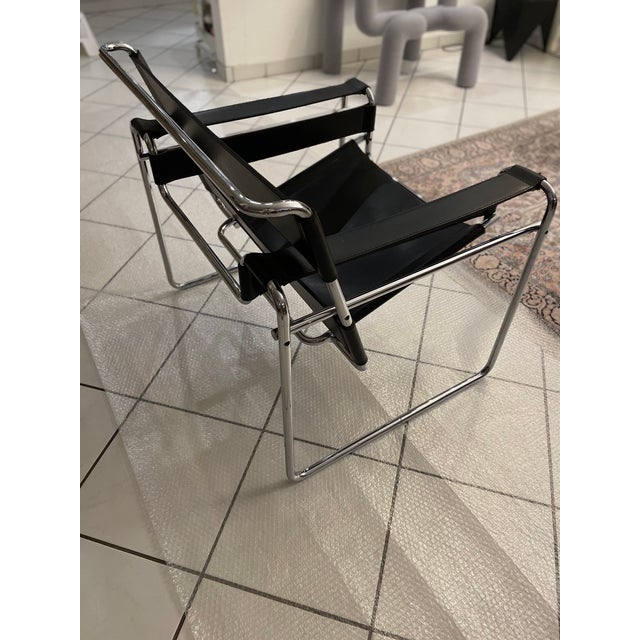 The legendary Wassily Lounge Chair by Marcel Breuer, in black leather, manufactured by Gavina (later part of Knoll), in...