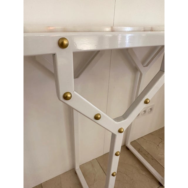 Nice geometrical contemporary console table “Y” in white lacquered metal, brass cabochon and marble with gold vein. Small...