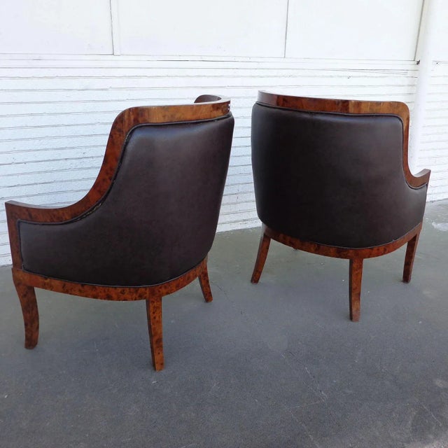 Pair of Art Deco style lounge chairs Burl framed lounge chairs upholstered in a rich eggplant fabric. Measures: 31.25?...