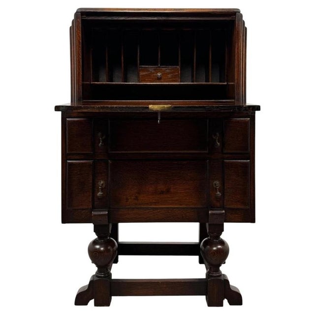 A charming and highly practical early 20th-century Edwardian oak bureau, combining elegant traditional styling with a...