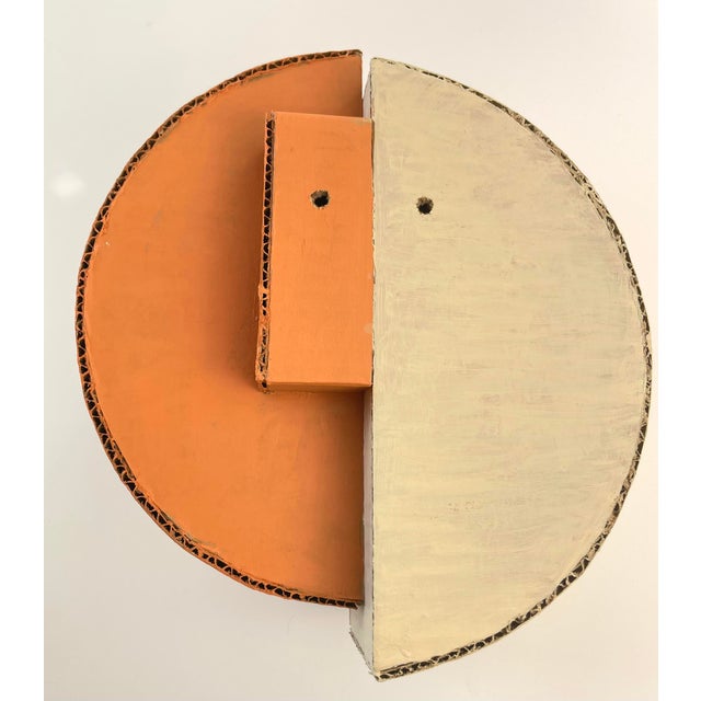 Add some 3-D interest to your wall or shelf with this 2-toned geometric sculpture painted in muted orange and creamy...