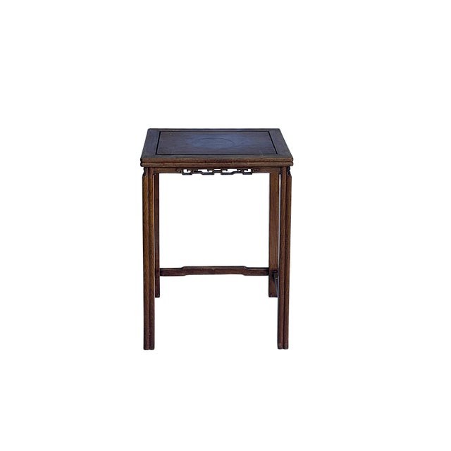 Exquisitely crafted in the traditional style, this vintage Chinese hardwood side table or tea stand features a floating-...