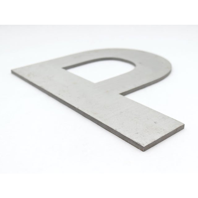 Vintage block style letter P made of aluminum with a brushed finish. The piece has a flat back. Good condition with...