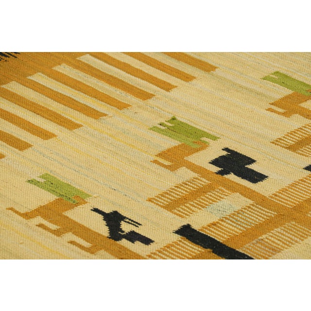 Made with handwoven wool circa 1950-1960, this 7x9 vintage Scandinavian Kilim rug is an exciting new addition to Rug &...
