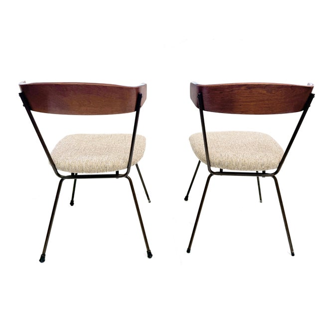 Beautiful pair of mid-century modern dining chairs by the iconic 1950's designer Clifford Pascoe, featuring sculpted wood...