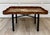 Here is a vintage Italian Chinoiserie tole tray coffee table, featuring a beautifully hand-decorated brown metal tray with...