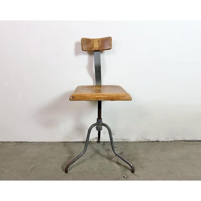 Industrial height adjustable swivel chair made in former Czechoslovakia during the 1950s.The construction is made of gray...