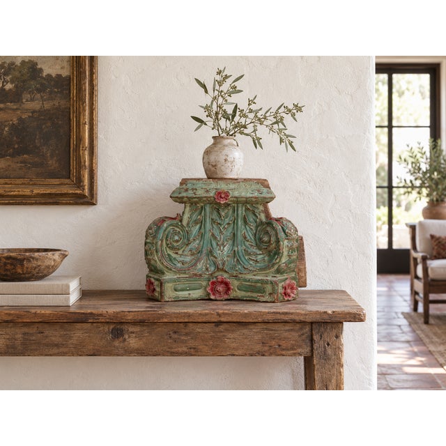 Coral rosettes bloom on a field of soft green. This antique teak capital is the showpiece of the collection, carved in...