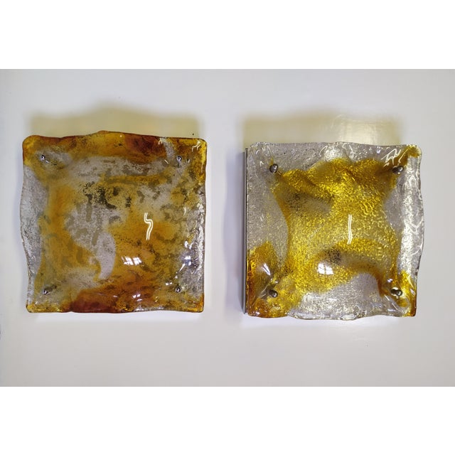 These two Mazzega Wall lights was manufactured in Murano by Mazzega. Each glass Is handmade and unique piece. Working. The...
