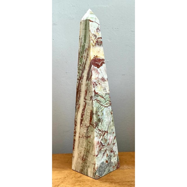 Meticulously carved from natural multi-hued onyx, this vintage stone obelisk showcases the breathtaking organic art of...