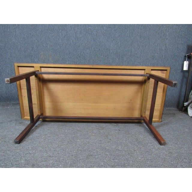 Absolutely gorgeous mid-century modern rosewood coffee table- sure to be a perfect addition to any living room, foyer, or...