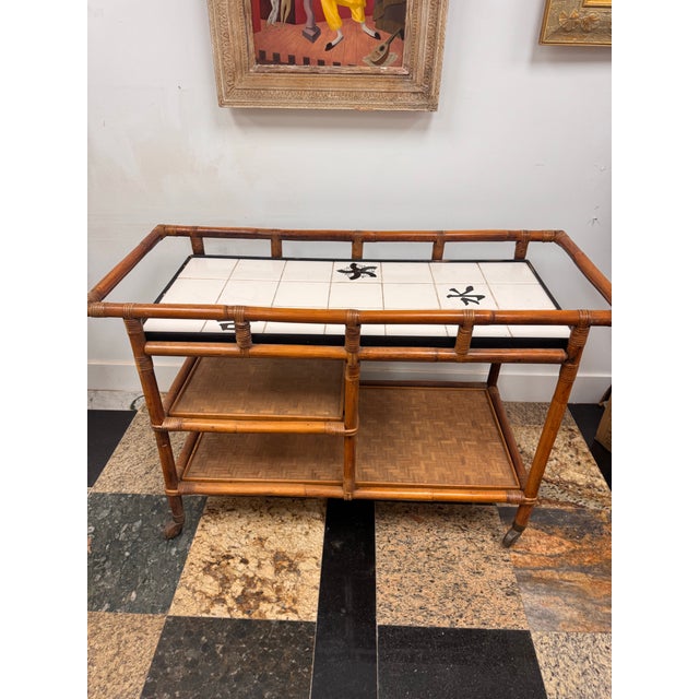 John Wisner for Ficks Reed Faux Bamboo Rattan Bar Cart with Tile Top, Mid-Century Description: Mid-century faux bamboo...