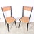 Pair of wood and vinyl chairs attributed to Carlo De Carli, dating from the 1950s. Made of walnut, they are finished with...