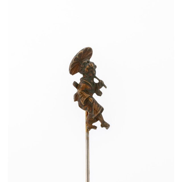 Antique Geisha with Parasol 10K Gold Stick Pin, 19th century, featuring one motif depicting a strolling lady with parasol,...