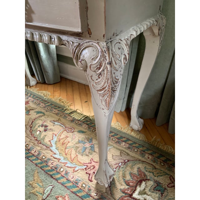 This elegant entry table, begs attention! Aged and distressed to Perfection. The carved details of this table have been...