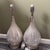 Discover this rare pair of monumental table lamps from the renowned Chapman Manufacturing Company of Avon, Massachusetts....