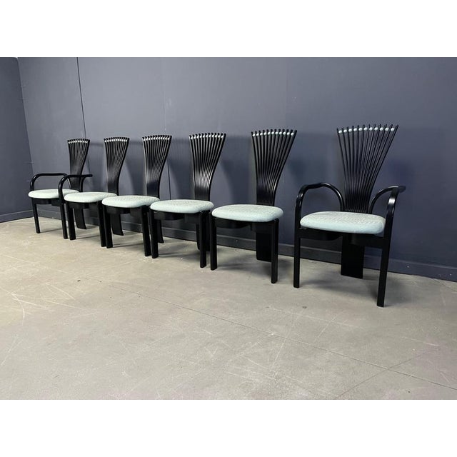 Scandinavian Postmodern dining chairs designed by Torsten Nilsen for Westnofa. Striking design with ebonized wooden frames...