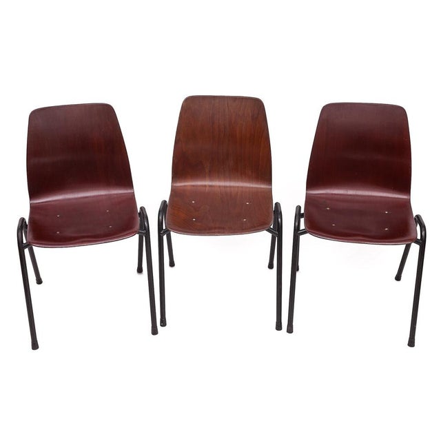 Set of 6 stackable chairs designed in West Germany by Pagholz. Seat shell in Pagwood (thermally molded beech injected with...