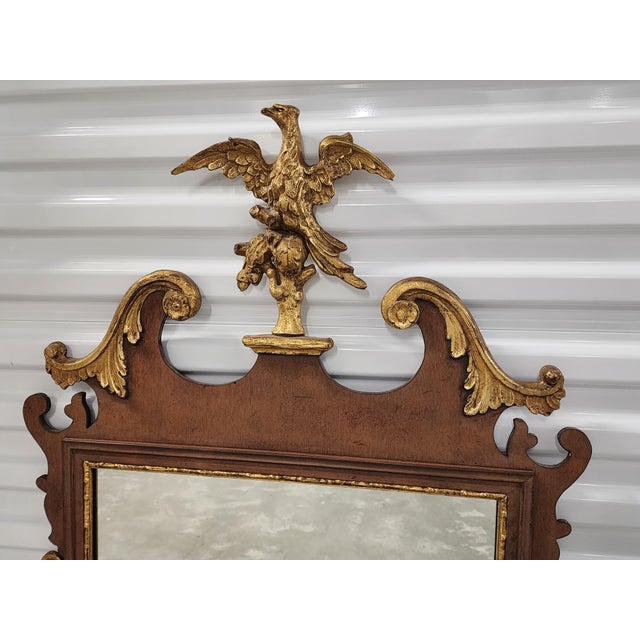 Vintage American made Friedman Brothers Chippendale style mahagony mirror featuring a carved gilt eagle crest and gilted...