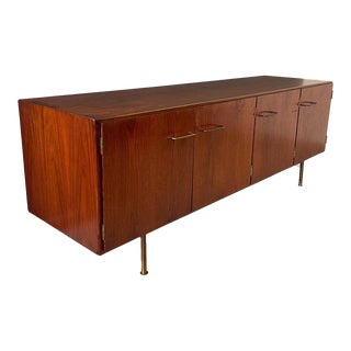 1950s Jens Risom Early Walnut Credenza with Four Doors, Brass Pulls and Legs For Sale