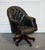 Vintage Chesterfield Dark Aged Grey Leather Directors Swivel Captain's Chair A striking embodiment of timeless elegance...