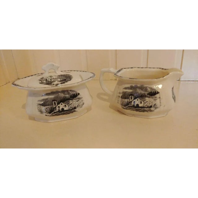 Enchant your table with this sugar bowl and creamer in old Maastricht. Country decoration with black transfer. This piece...
