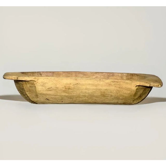 Antique primitive large Swedish trough style dough bowl, c. 1850. Hand-carved from a single piece of wood, this robust,...
