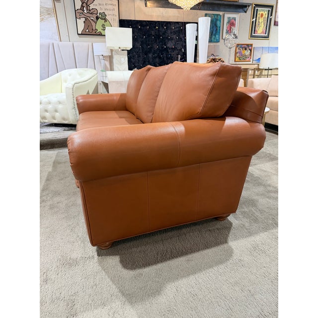 A timeless expression of American craftsmanship, this Ethan Allen “Conor” Rust Leather Sofa blends classic comfort with...