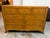 Design Plus Gallery presents a Nine-Drawer Dresser from Bausman & Company. This dresser showcases a mitered plank top with...