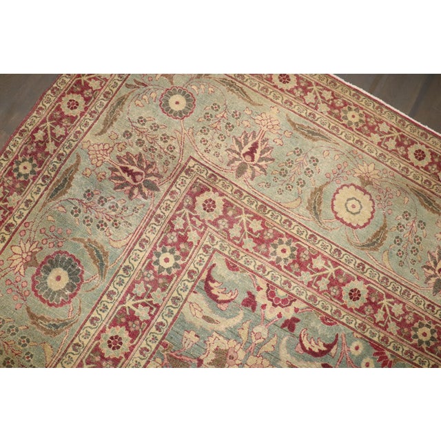 An early 20th-century Persian meshed rug in predominantly faded green with accents in raspberry Details rug no. 8098 size...