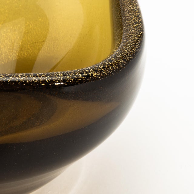Radiating elegance, this hand-blown Murano dish in a warm tobacco hue is a celebration of Venetian glassmaking heritage....