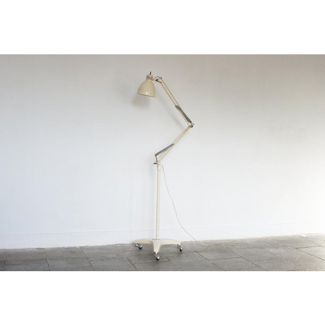 A sleek, industrial medical lamp manufactured by LANZONI Bologna – an Italian manufacturer of specialist surgical lamps,...