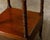 An English mahogany three-tiered étagère from the 19th century with lower drawer, turned supports and casters. This...