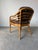 Elegant vintage accent -dining chair by Brown Jordan, crafted in warm honey-toned rattan with their signature sculptural...