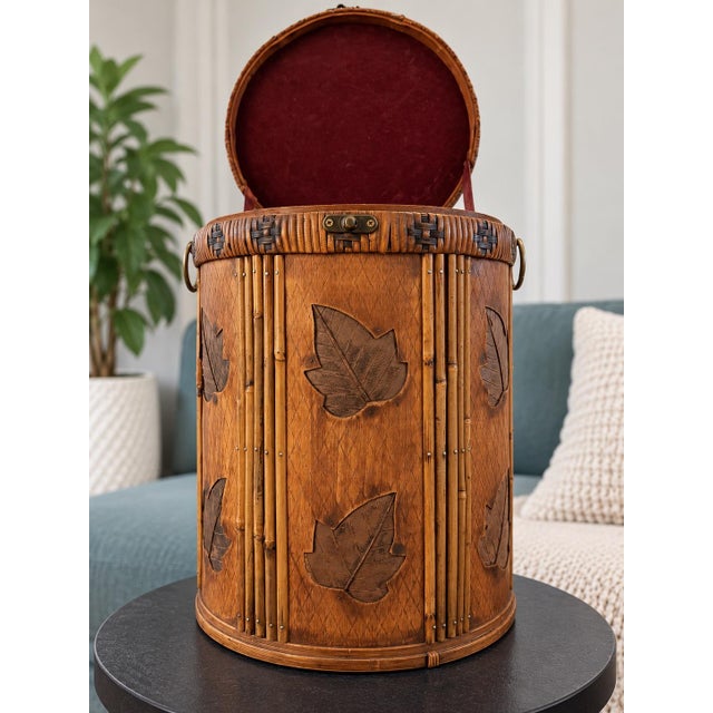 Beautiful vintage round storage chest featuring a gorgeous combination of bamboo, woven rattan, wood, and decorative brass...